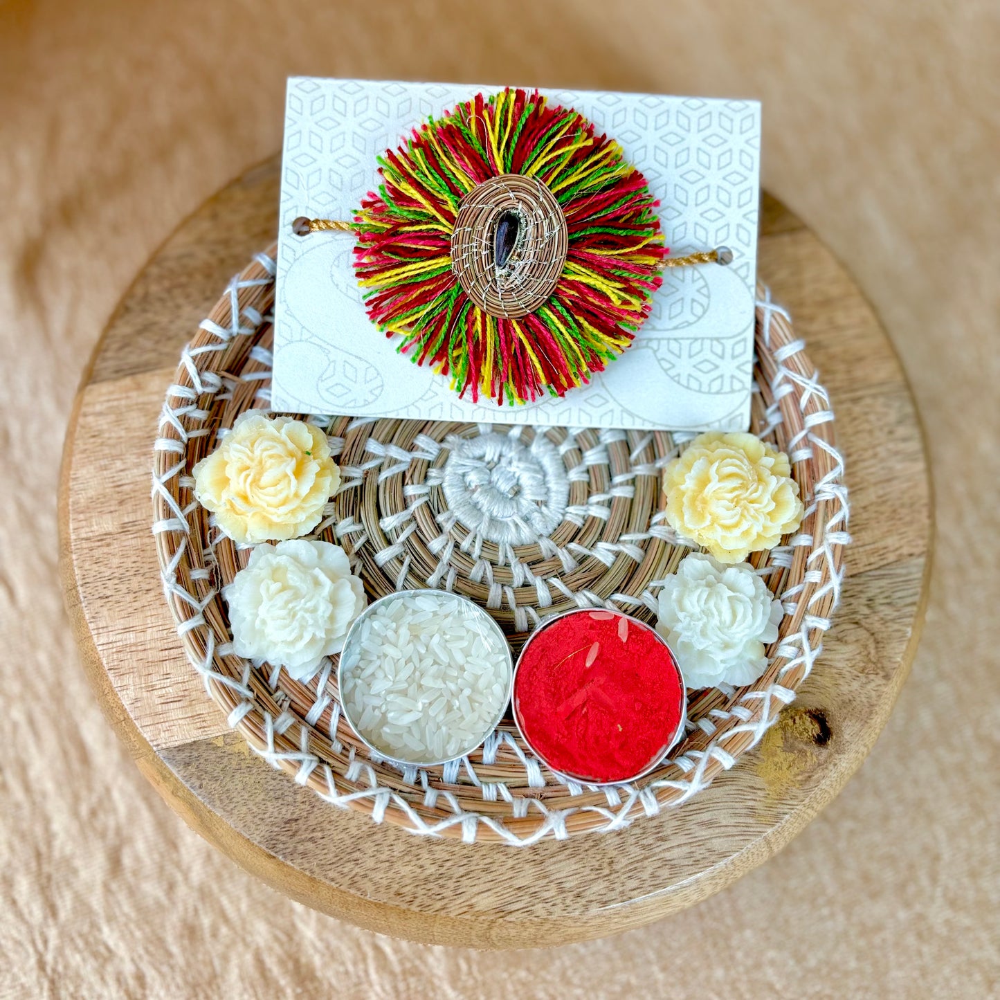 SOE Plantable Pine Needle Rakhi: AMBOLI with sunflower seed (with rice & tikka)