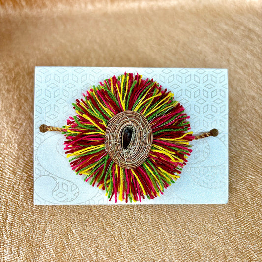 SOE Plantable Pine Needle Rakhi: AMBOLI with sunflower seed (with rice & tikka)