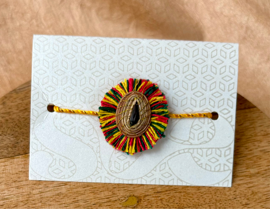 SOE Plantable Pine Needle Rakhi: KETKI with sunflower seed (with rice & tikka)