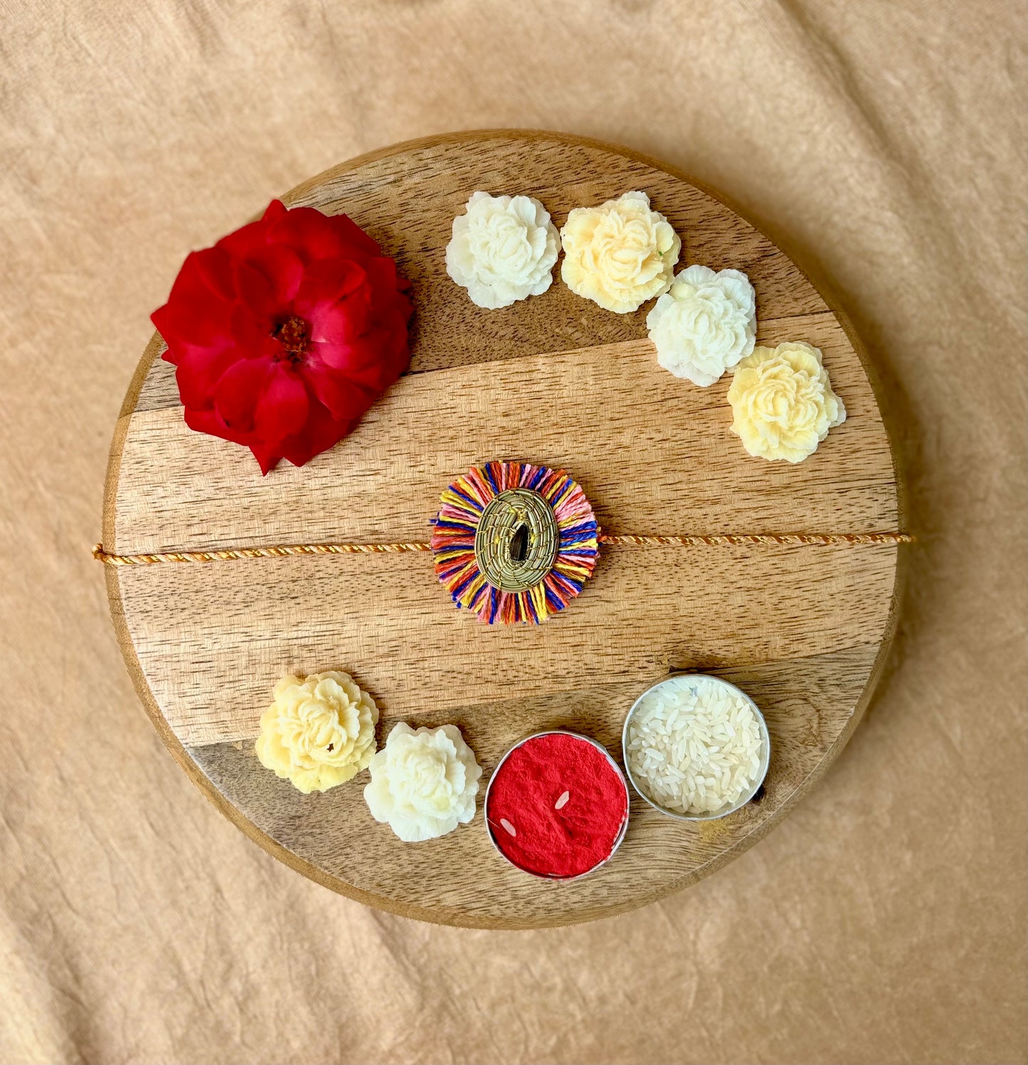 SOE Plantable Pine Needle Rakhi: GULMOHAR with sunflower seed (with rice & tikka)