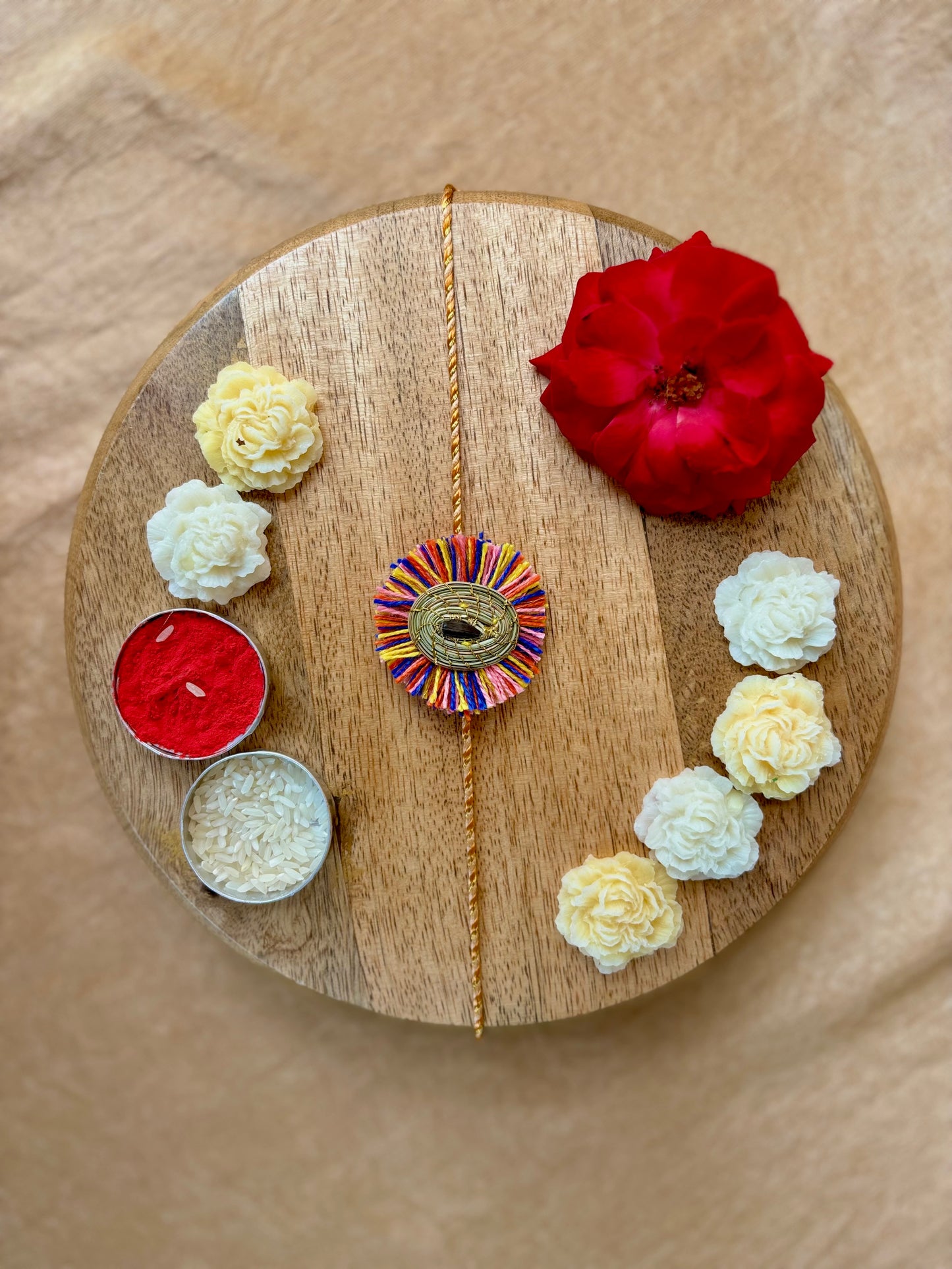 SOE Plantable Pine Needle Rakhi: GULMOHAR with sunflower seed (with rice & tikka)