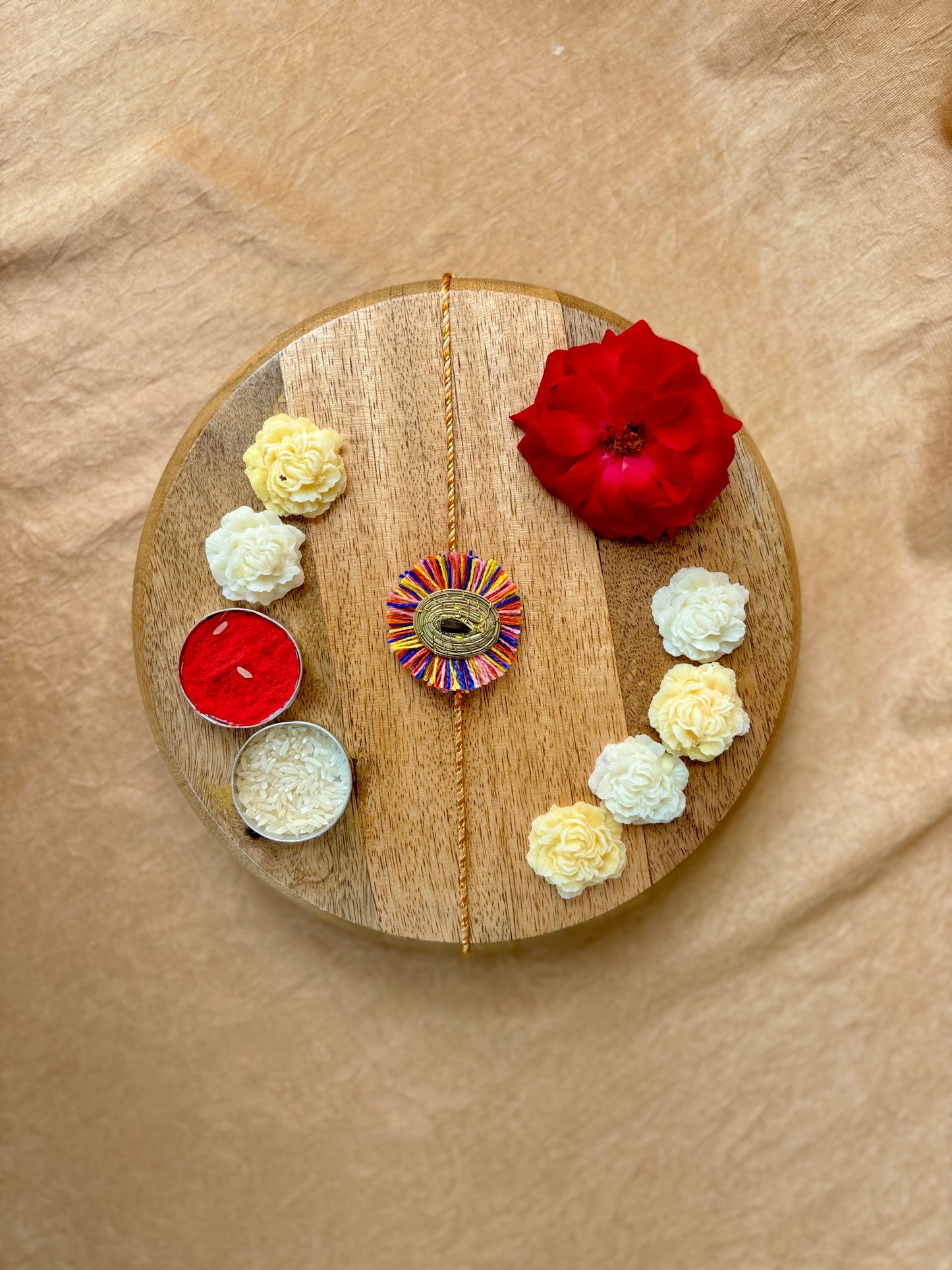 SOE Plantable Pine Needle Rakhi: GULMOHAR with sunflower seed (with rice & tikka)