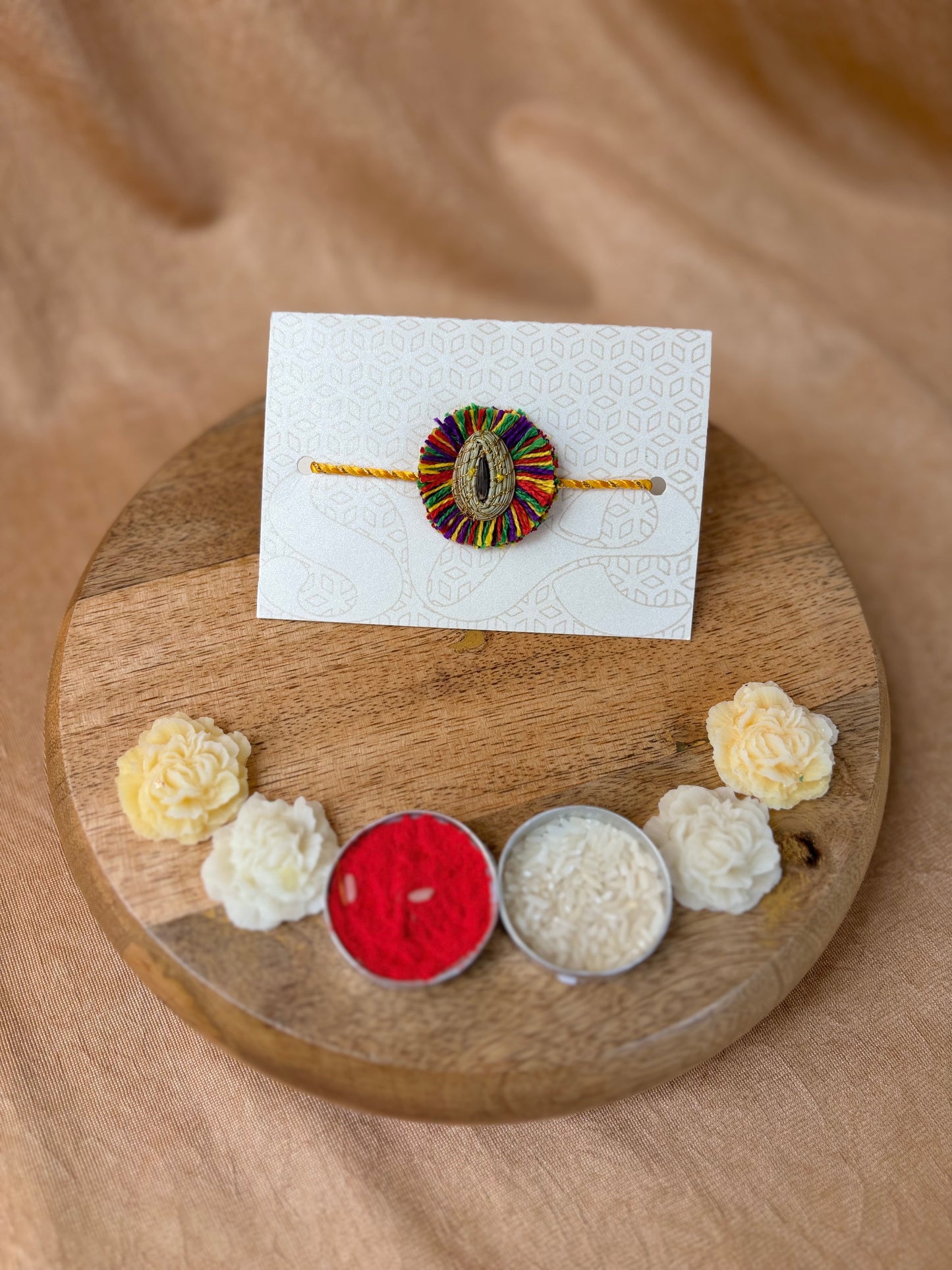 SOE Plantable Pine Needle Rakhi: GULKHARI with sunflower seed (with rice & tikka)