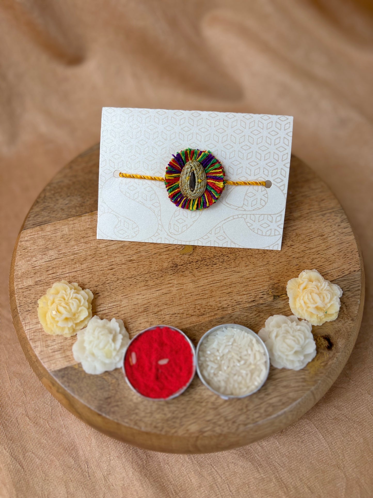 SOE Plantable Pine Needle Rakhi: GULKHARI with sunflower seed (with rice & tikka)