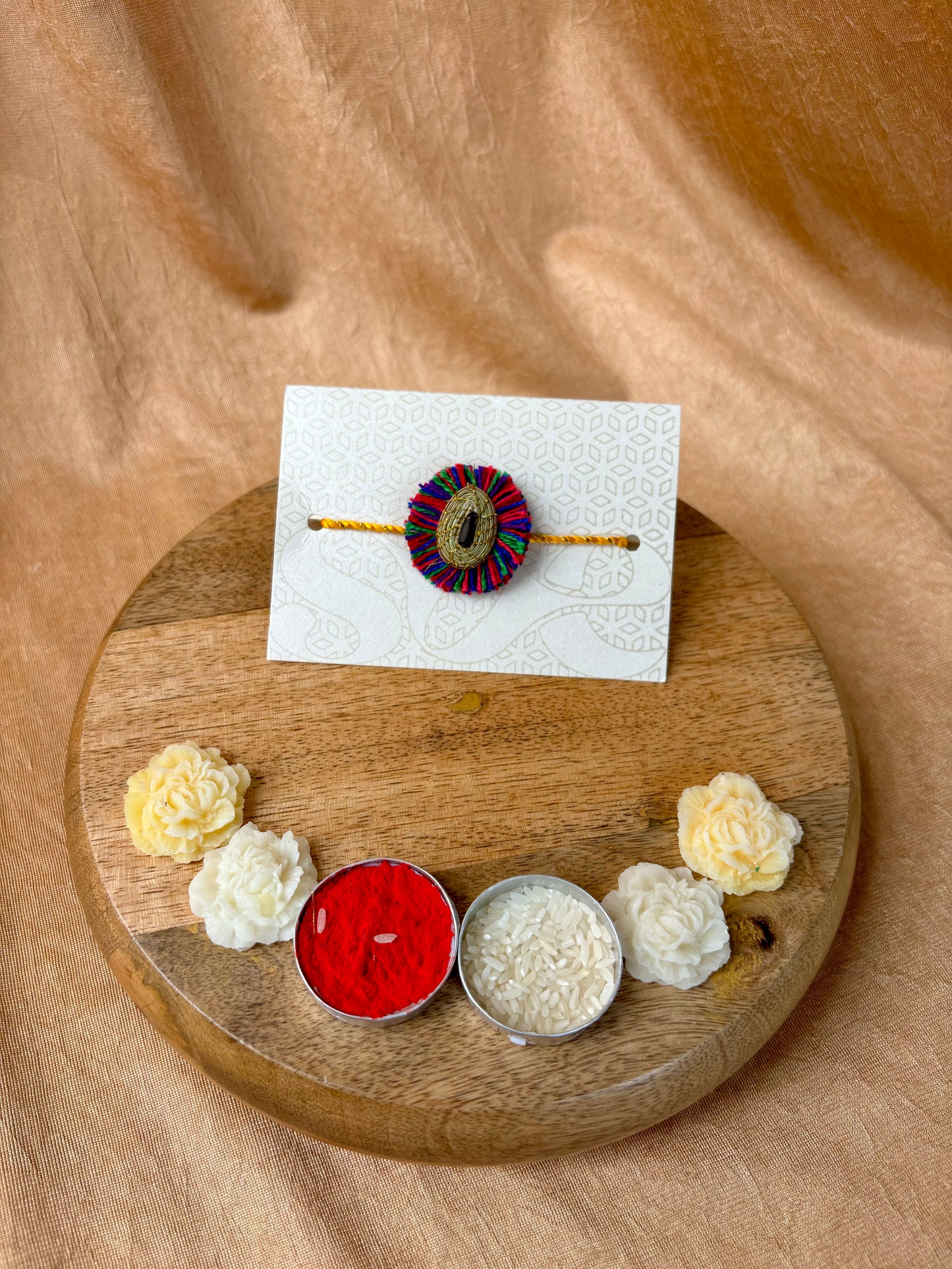 SOE Plantable Pine Needle Rakhi: MALTI with sunflower seed (with rice & tikka)