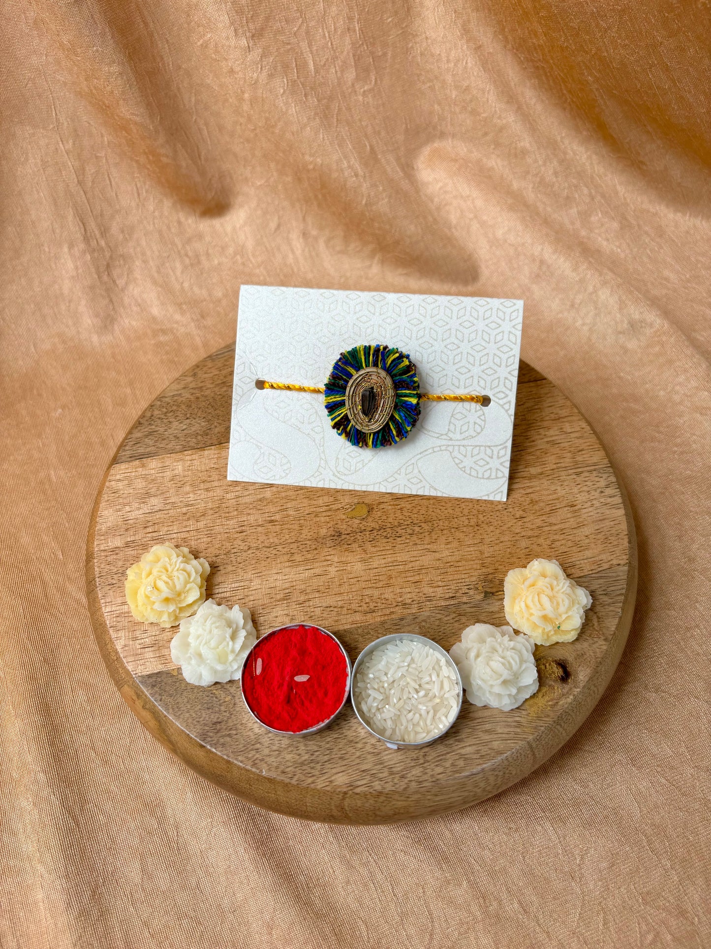 SOE Plantable Pine Needle Rakhi: APARAJITA with sunflower seed (with rice & tikka)