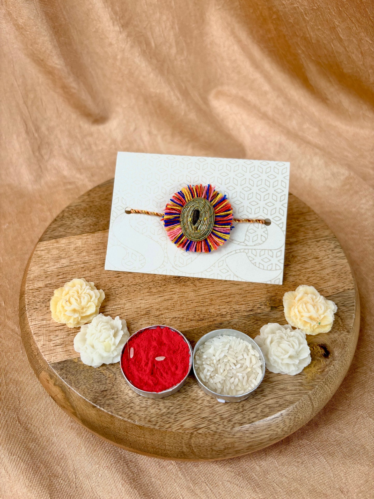 SOE Plantable Pine Needle Rakhi: GULMOHAR with sunflower seed (with rice & tikka)