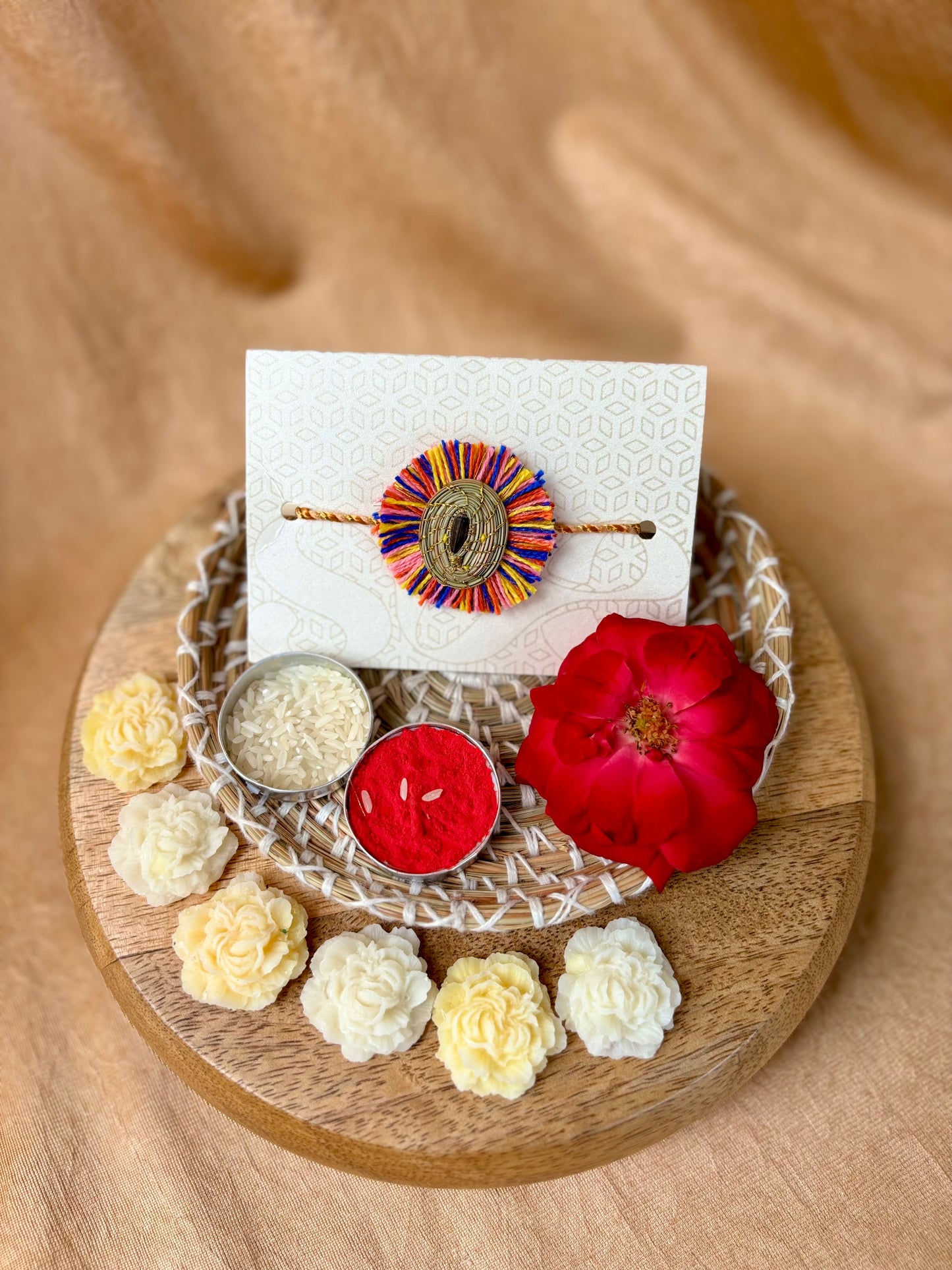 SOE Plantable Pine Needle Rakhi: GULMOHAR with sunflower seed (with rice & tikka)