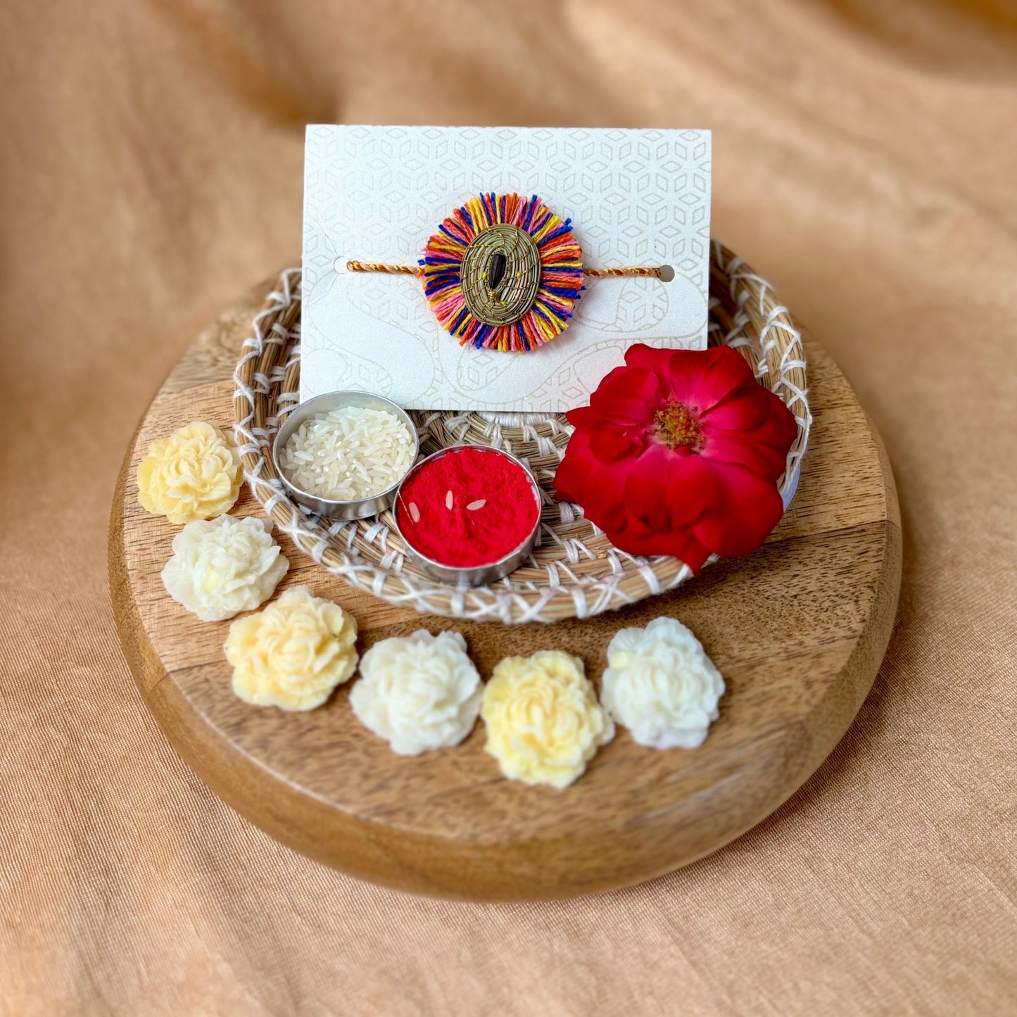 SOE Plantable Pine Needle Rakhi: GULMOHAR with sunflower seed (with rice & tikka)